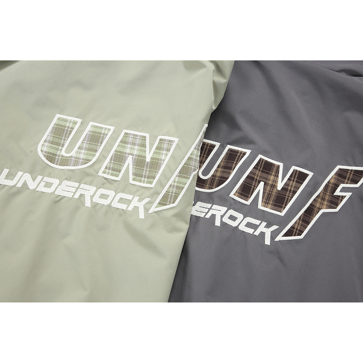 Close-up of pale green and charcoal jacket panels with large outlined lettering filled with plaid.