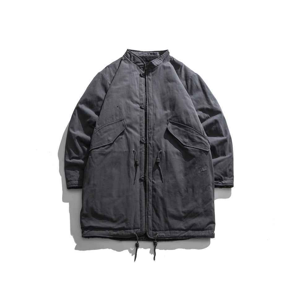 Charcoal coat shown flat from the front, with a stand collar, button closure, flap pockets, and drawcords.