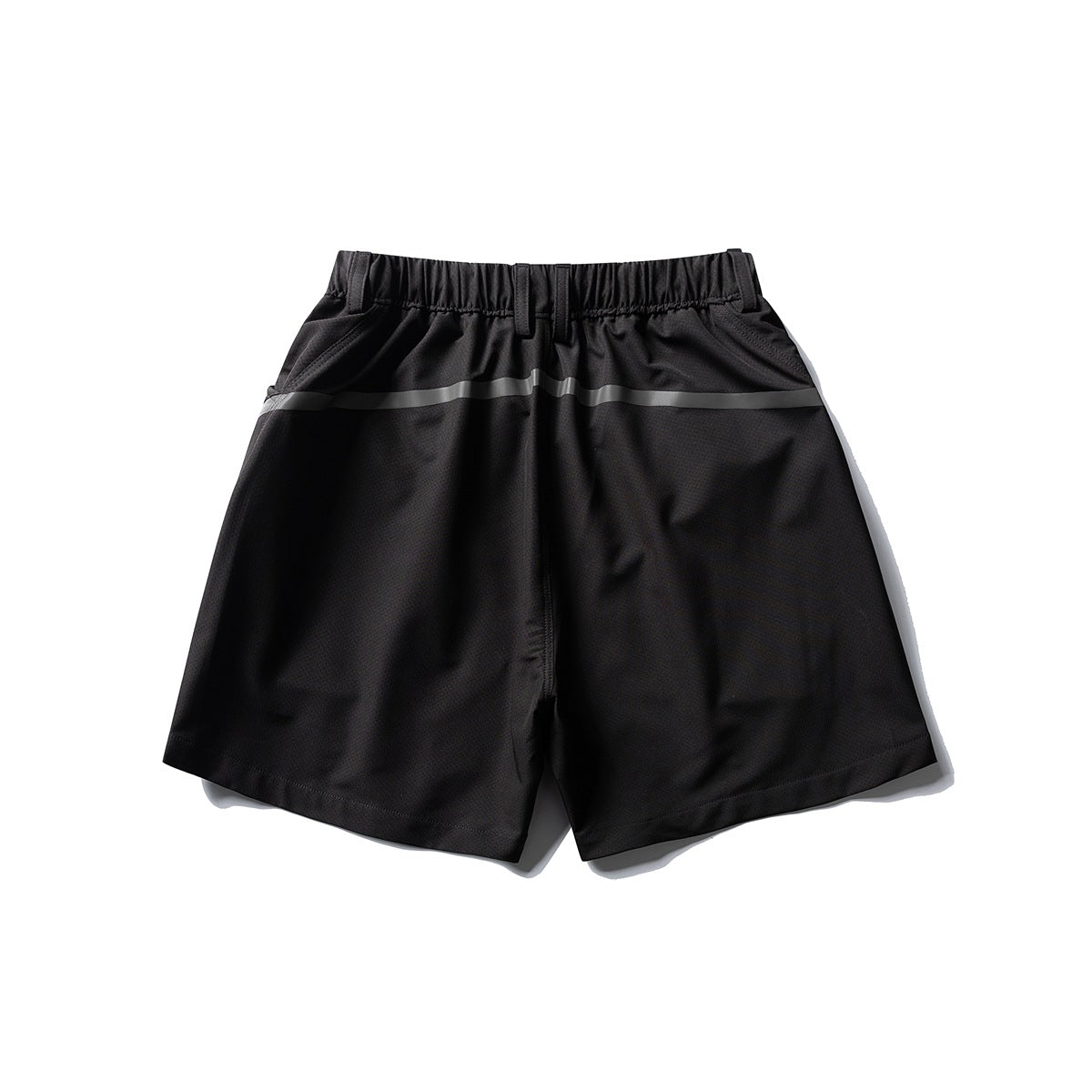 Front view of black shorts with an elastic waistband, belt loops, angled pockets, and a gray horizontal stripe.