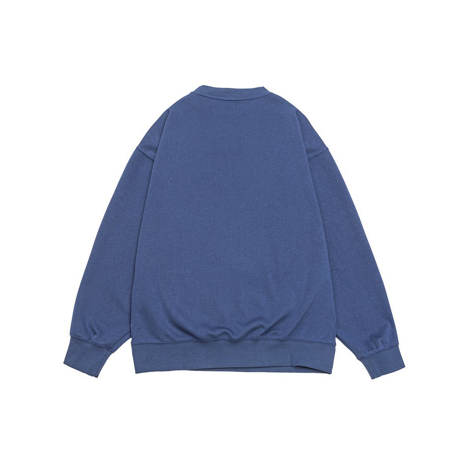 Back view of a muted blue crewneck sweatshirt laid flat against a white background.