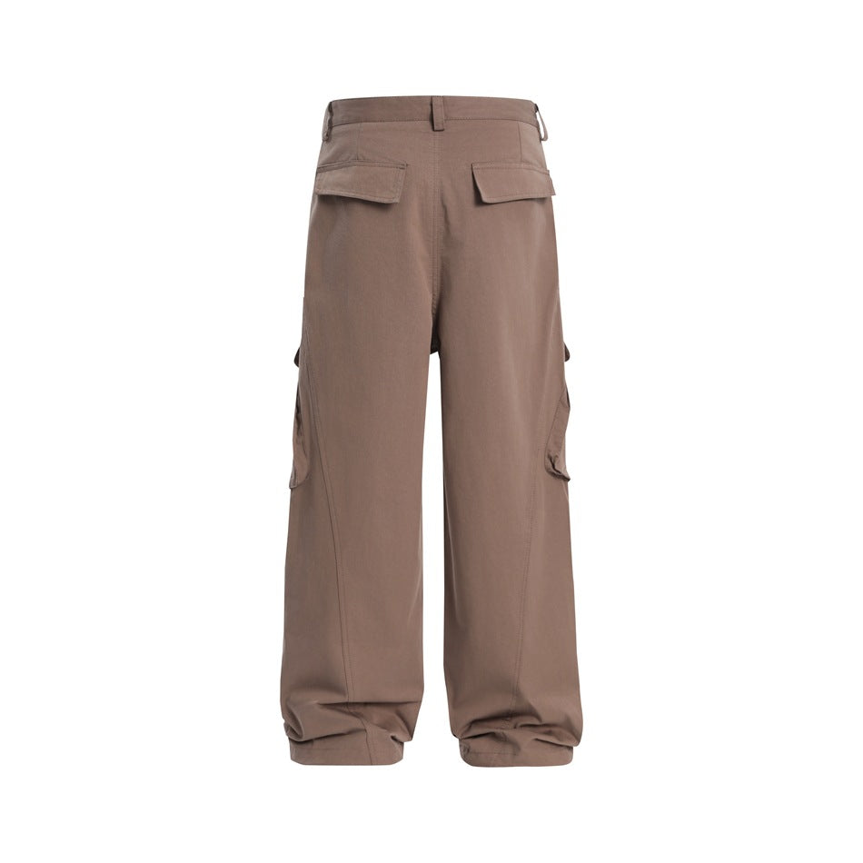 Back view of muted brown wide-leg cargo trousers with flap rear pockets and side cargo pockets.