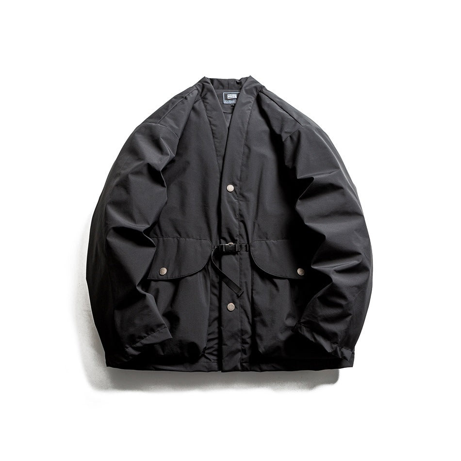 Black padded jacket with open V-neck, snap buttons, two flap pockets and waist buckle strap, flat view