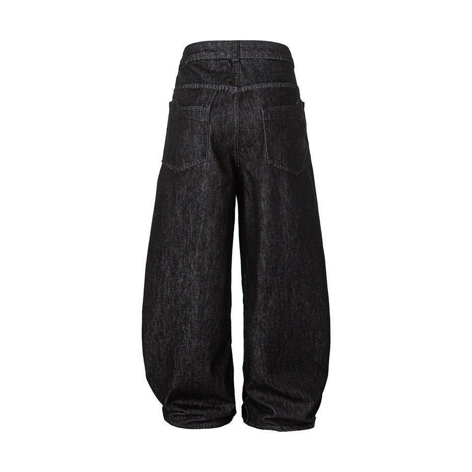 Back view of black wide-leg trousers laid flat, with two rear patch pockets.