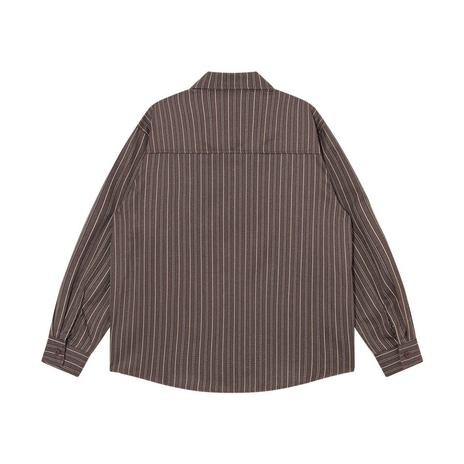 Back view of a brown shirt with narrow vertical stripes, a shoulder yoke, and button cuffs.