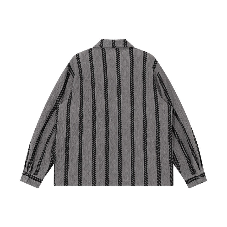 Back view of a gray long-sleeve collared shirt with vertical black braided stripes.