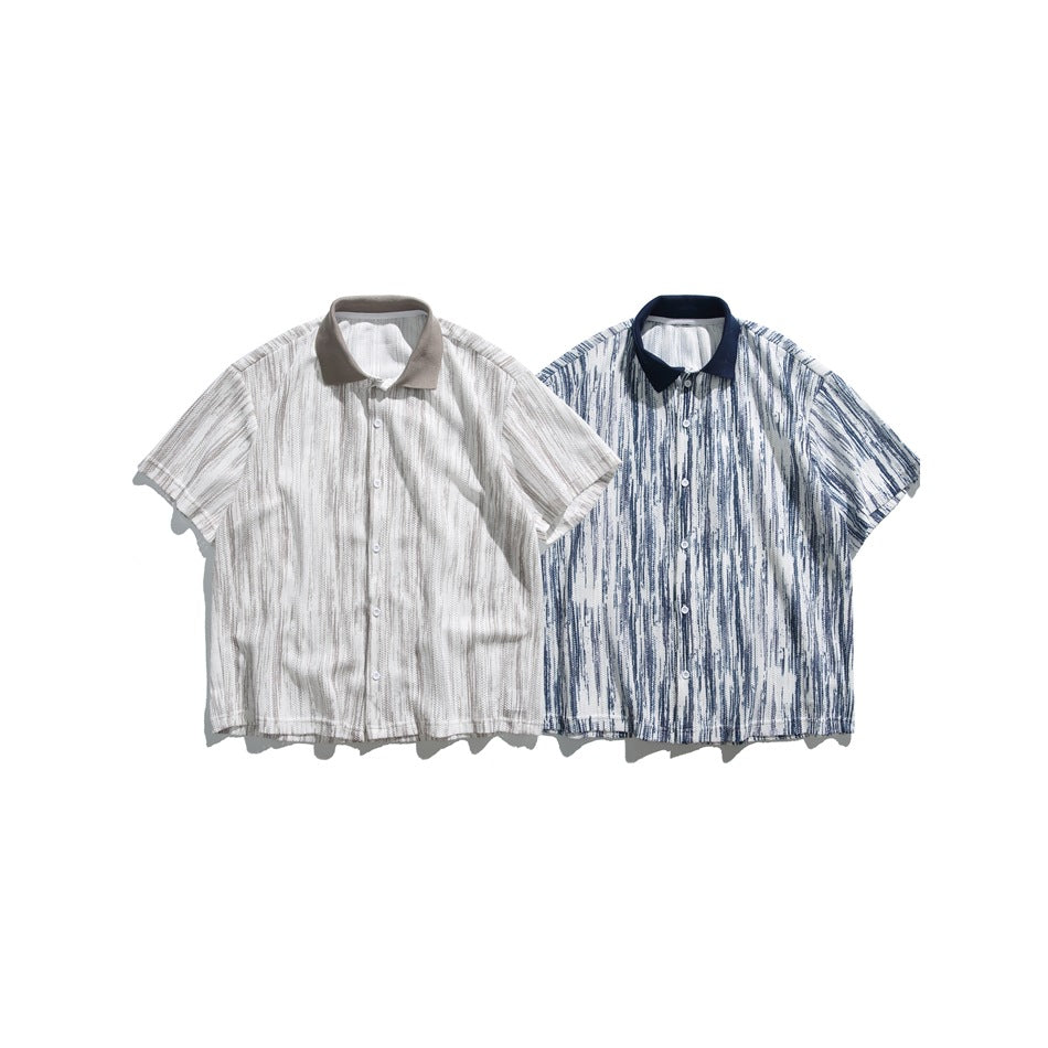Two short-sleeve button-up shirts shown from the front: one cream and taupe, the other white and navy striped.