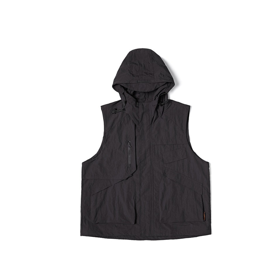 Dark gray hooded sleeveless utility vest, flat lay front view with chest zip pocket and lower patch pockets