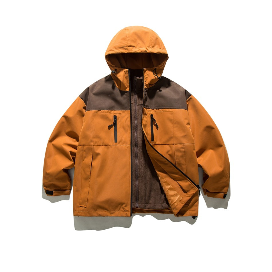 Front view of an orange hooded jacket with a dark brown shoulder panel, zip pockets, and fleece lining.