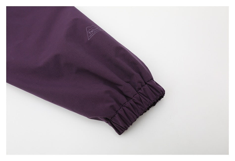 Purple sleeve with an elastic cuff and a small printed logo.