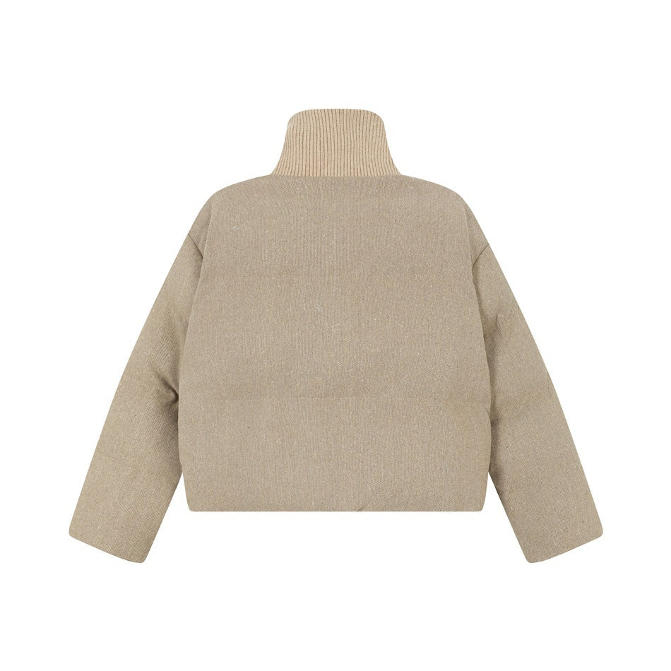 Back view of a taupe padded jacket with a tall ribbed collar and long sleeves, shown against white.