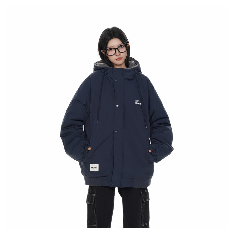 Model wearing a dark navy hooded jacket with a snap-front closure, drawstrings, and front pockets.