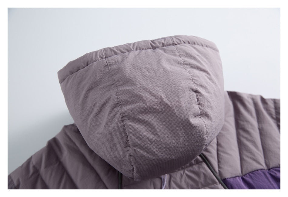 Close-up of the mauve jacket hood and its stitched panel seams.