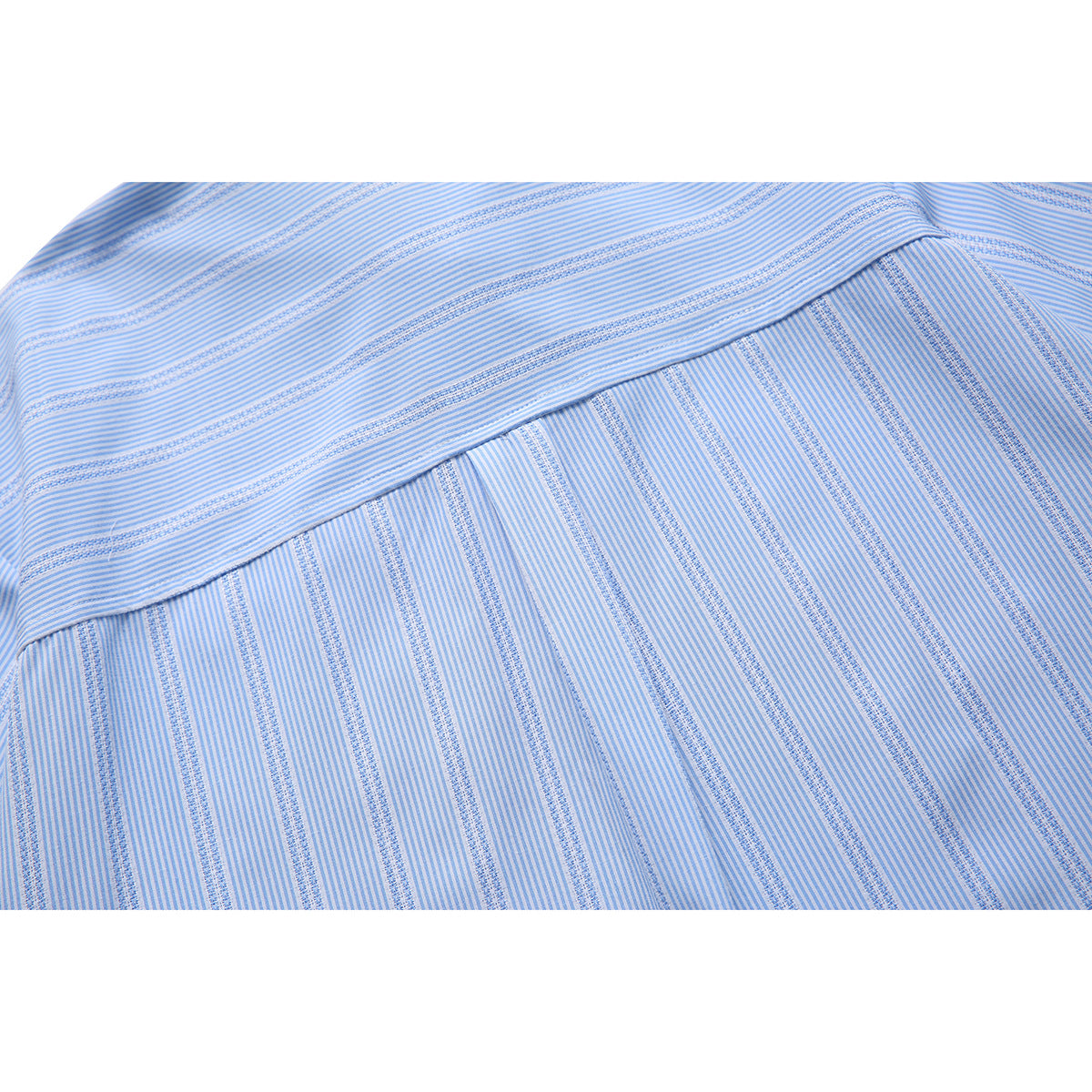Close-up of the light blue shirt's back yoke seam and alternating stripe patterns.