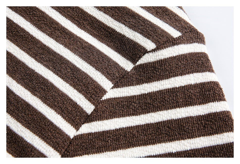 Close-up of the shoulder seam on a brown-and-cream striped knit top.