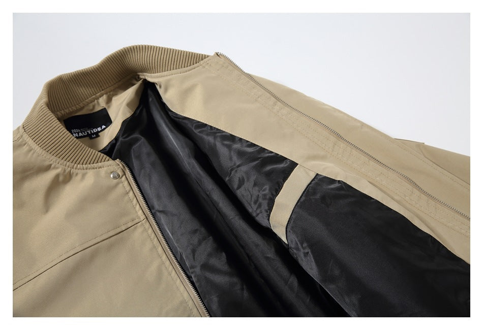 Beige jacket opened to show its dark lining, ribbed collar, zipper, and sewn-in neck label.