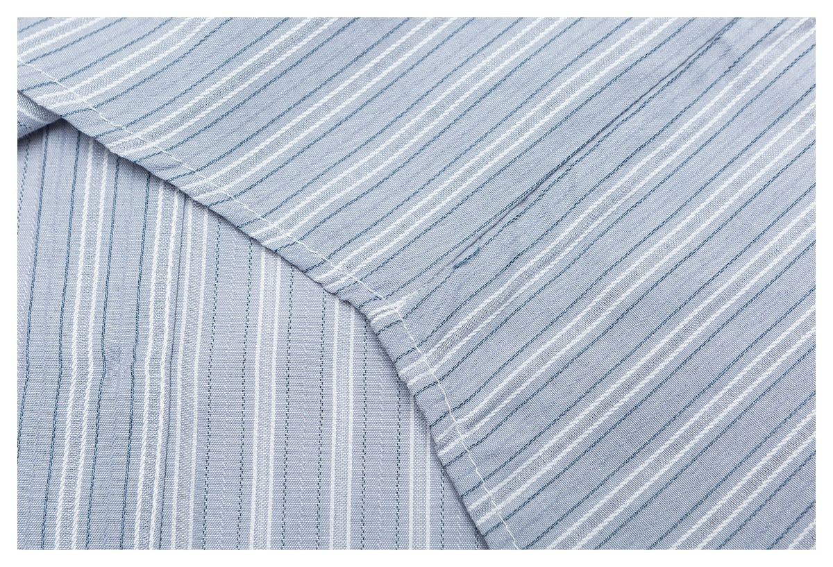Close-up of the striped shirt fabric and a stitched overlapping seam.