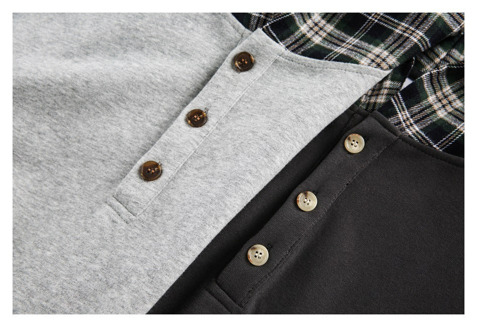 Close-up of gray and black tops with brown buttons and a green, black, and cream plaid section.
