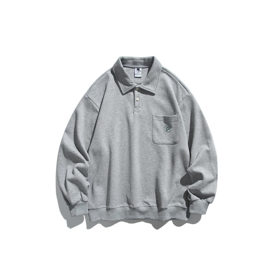 Front view of a heather gray collared pullover with a two-button placket, embroidered chest pocket, and ribbed trim.