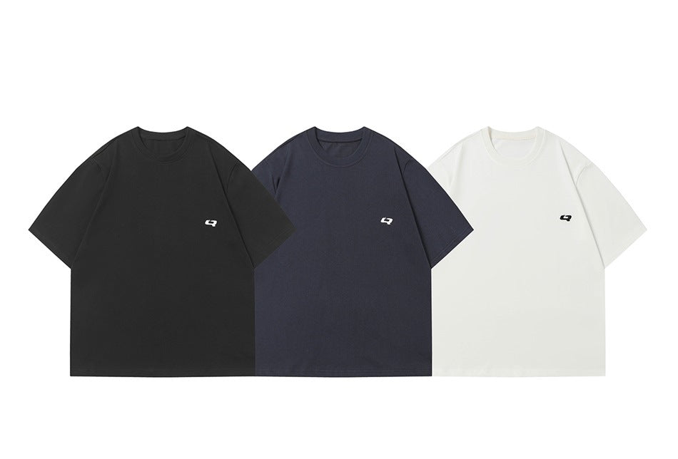 Black, navy and white short-sleeve T-shirts shown side by side, each with a small chest logo mark