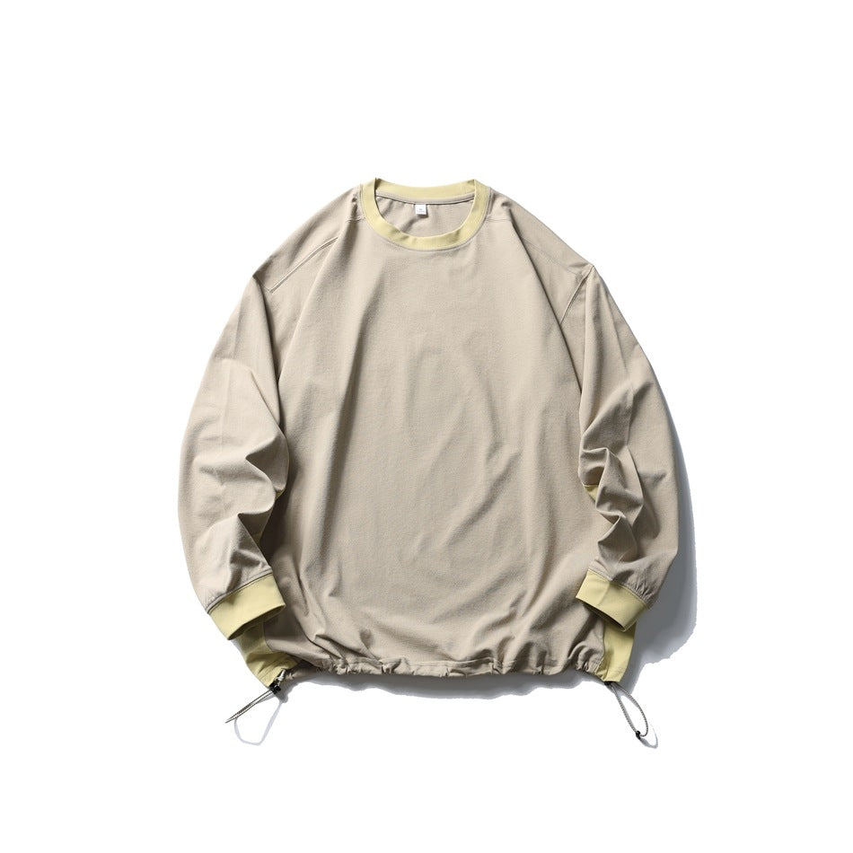 Khaki crewneck pullover with pale yellow ribbed collar and cuffs and drawcord hem, flat lay