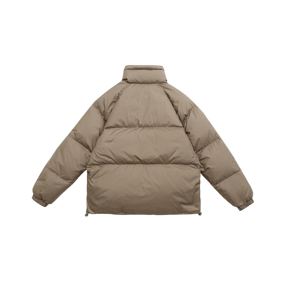 Back view of a taupe quilted puffer jacket with a stand collar, horizontal baffles and elastic cuffs.