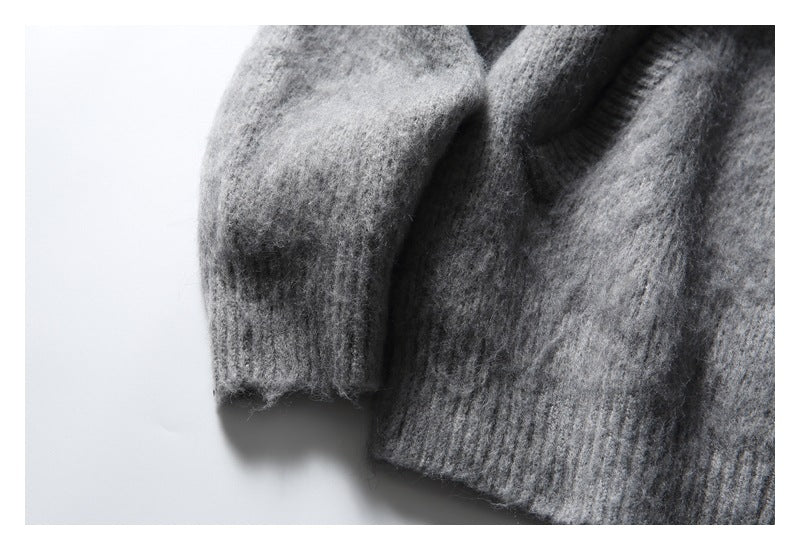 Close-up of the gray cardigan's sleeve cuff and ribbed lower hem.