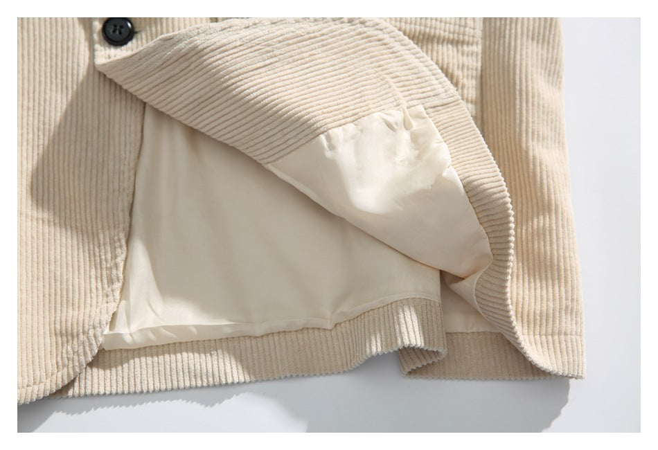 The cream jacket is opened to show its smooth light-colored inner lining.