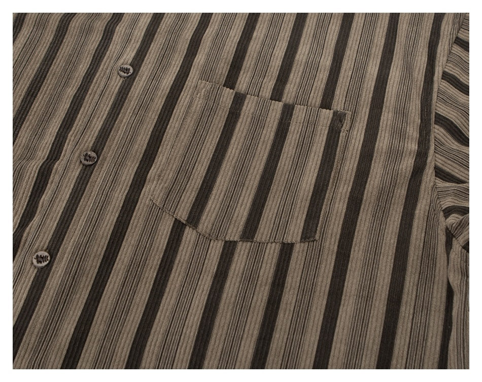 Close-up of the striped shirt's button placket and single chest pocket.