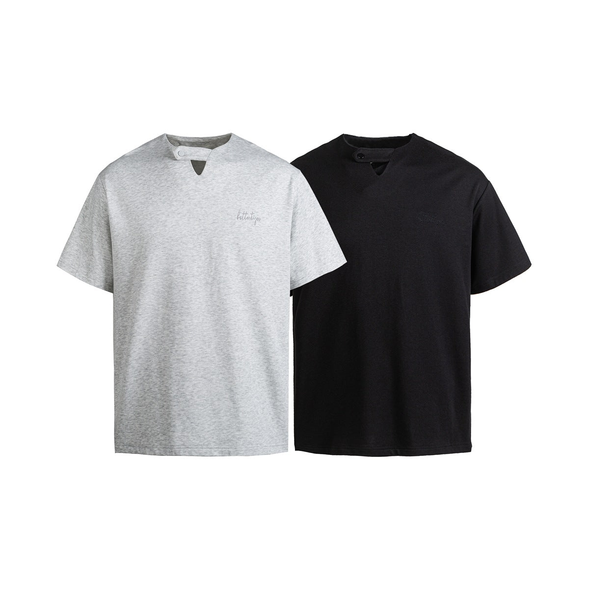 Front view of two short-sleeve shirts in light gray and black, each with a snap neckline.