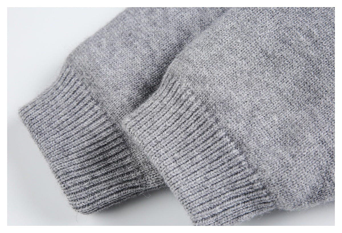 Close-up of the gray knit jacket's sleeve ends with ribbed cuffs.