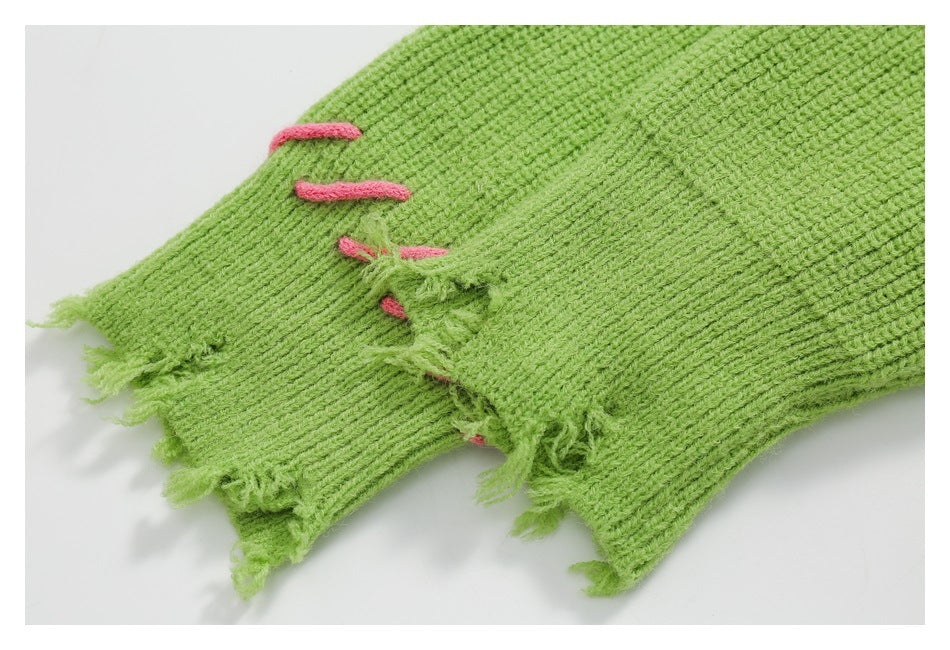 Close-up of frayed lime-green ribbed knit with short pink embroidered bars.