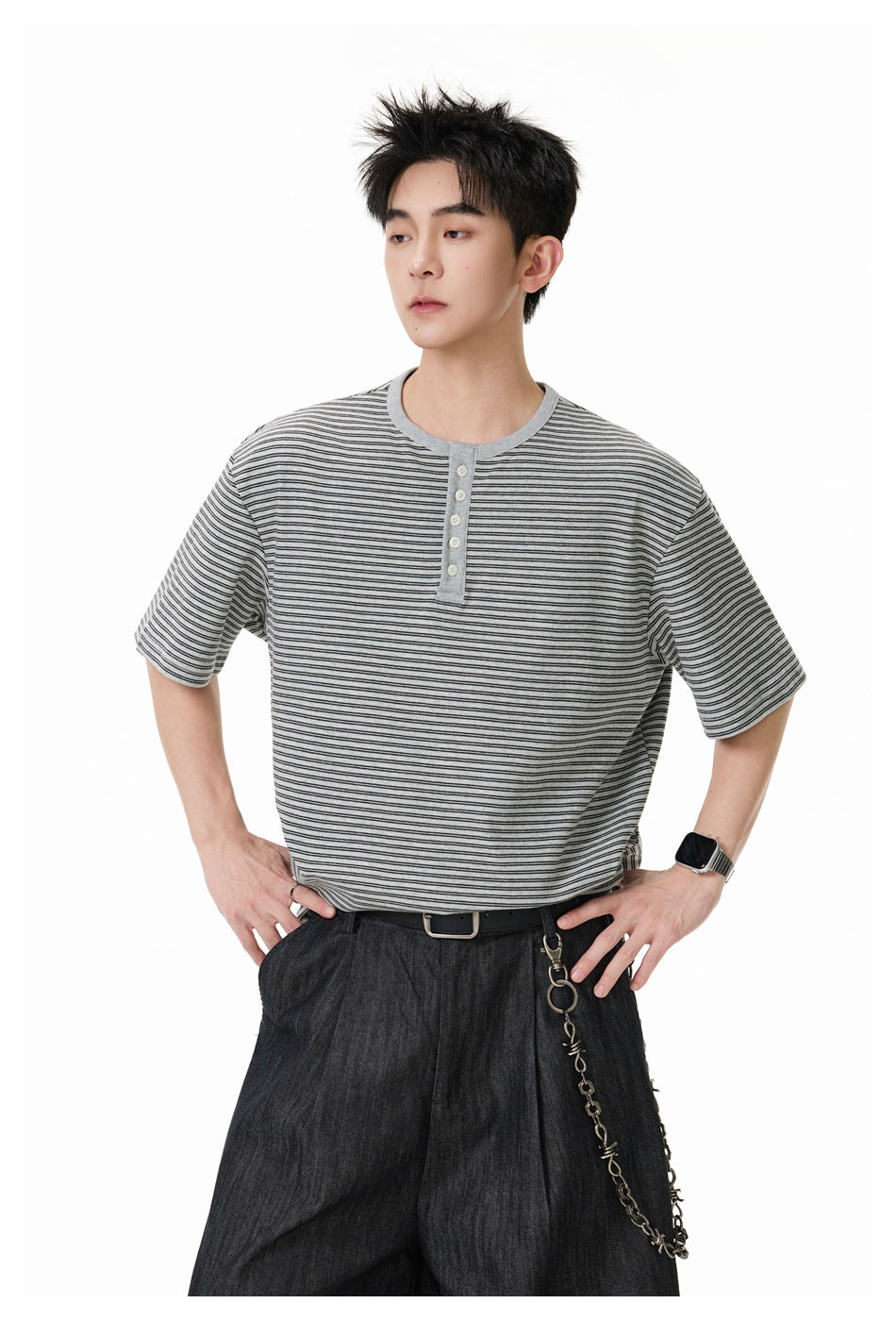 Close view of a model wearing a gray striped short-sleeve henley with a buttoned placket.