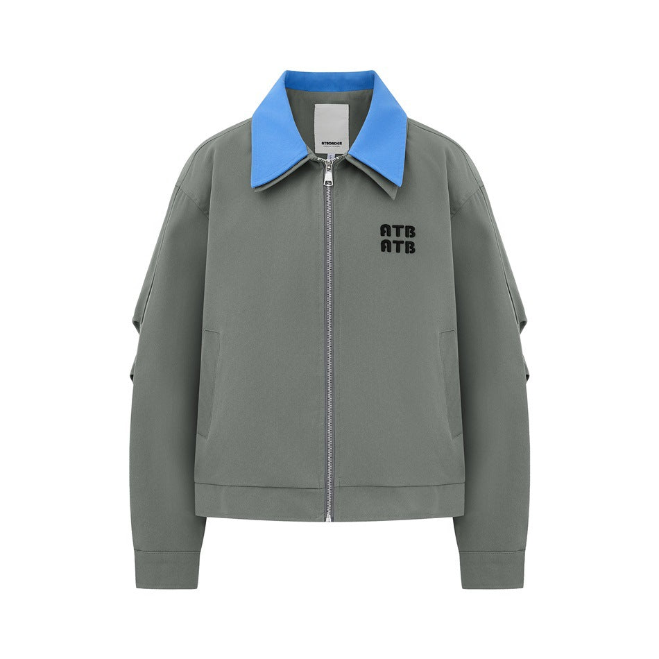 Gray-green zip jacket with blue collar and black ATB lettering on the chest, flat front view