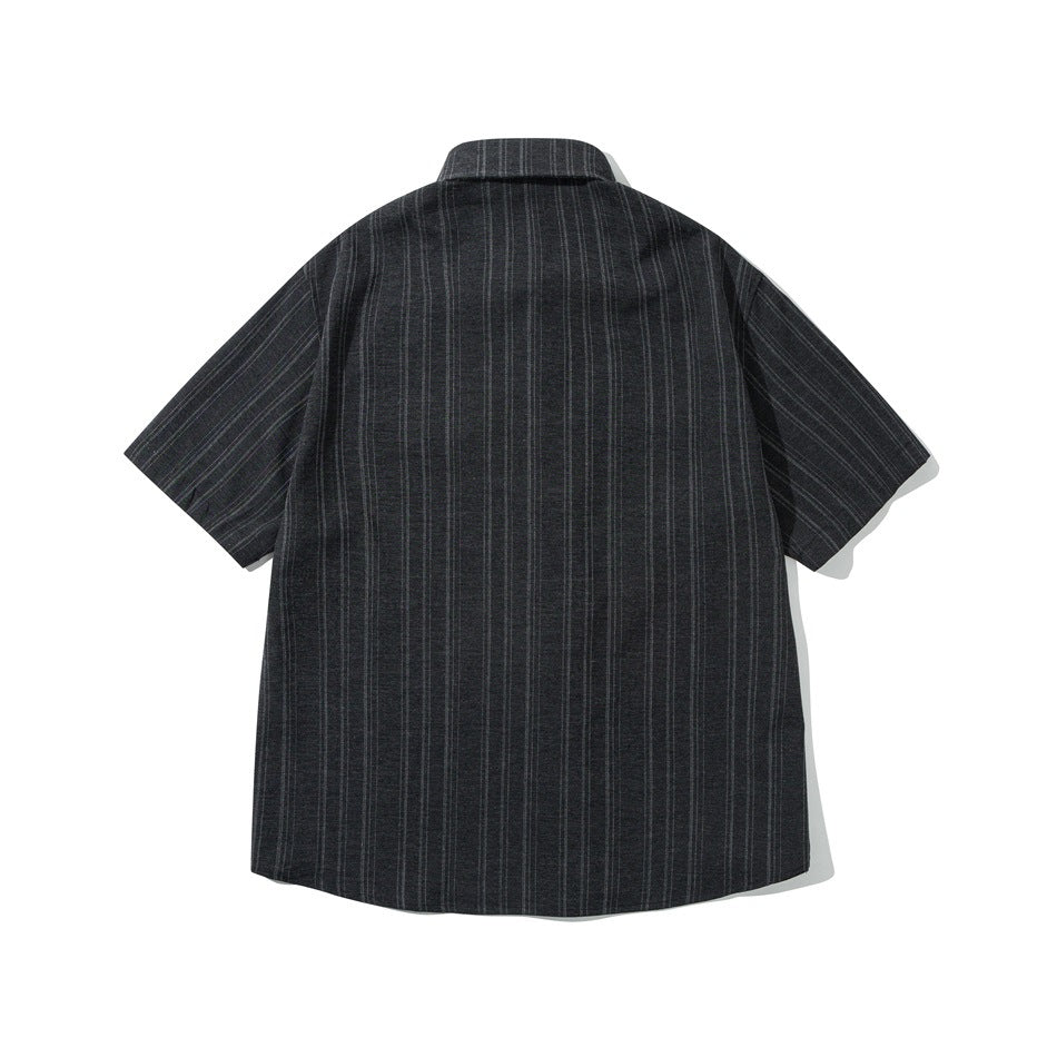 Back view of black striped short-sleeve shirt with a pointed collar, flat lay