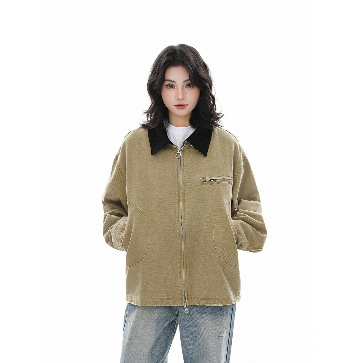 Model wearing a khaki zip-front jacket with a black collar, curved pockets and a chest zipper pocket.