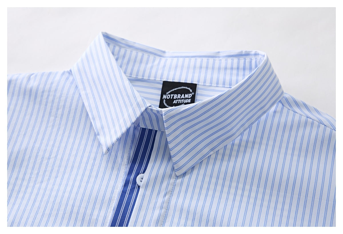 Close-up of a white shirt collar with fine blue stripes and a dark blue striped placket.