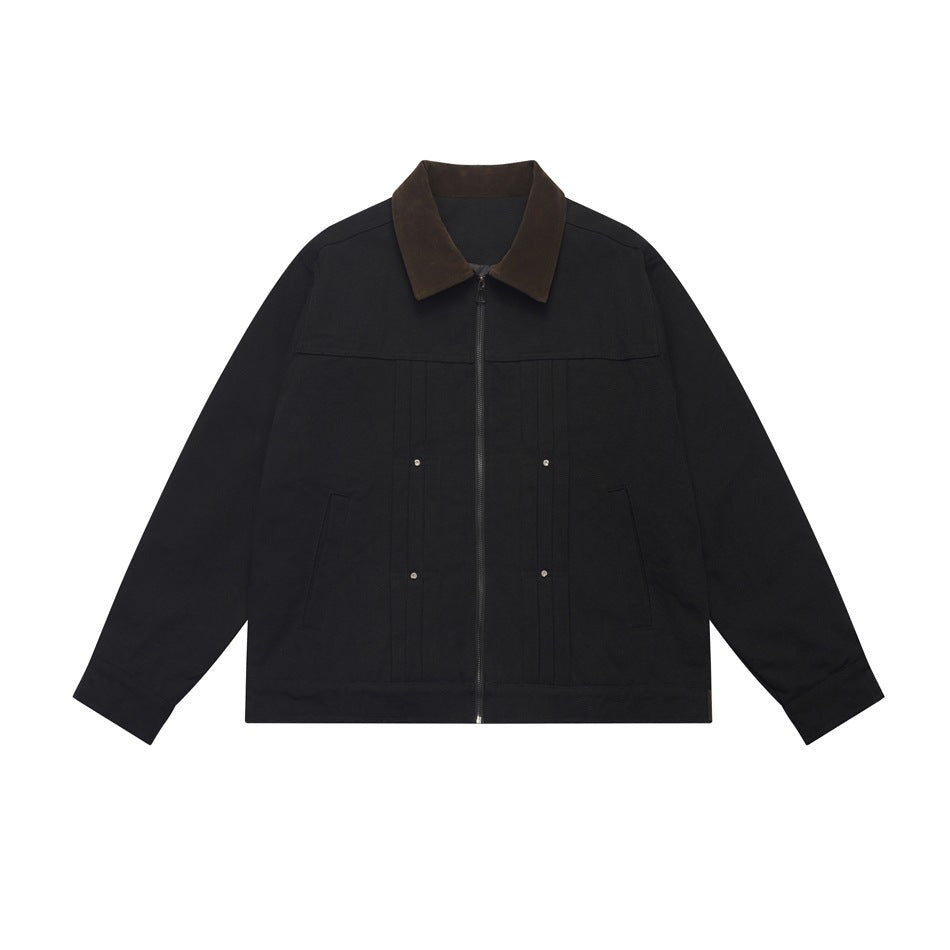 Black zip-front jacket with dark brown contrast collar, pleat details, stud accents and slanted pockets, flat lay