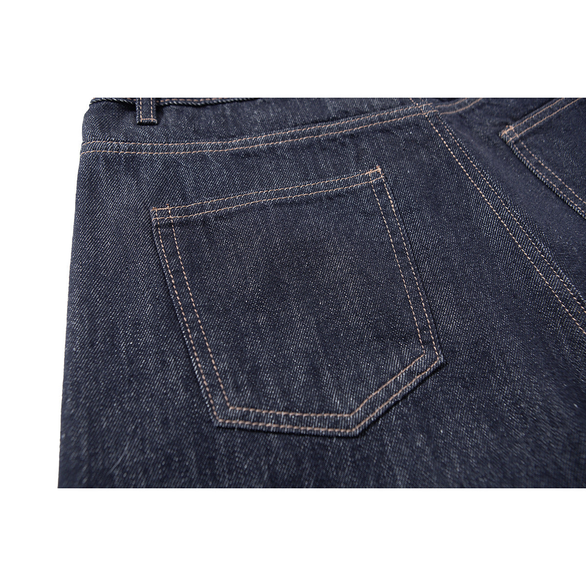 Close-up of a dark indigo jeans back pocket with contrast double stitching.