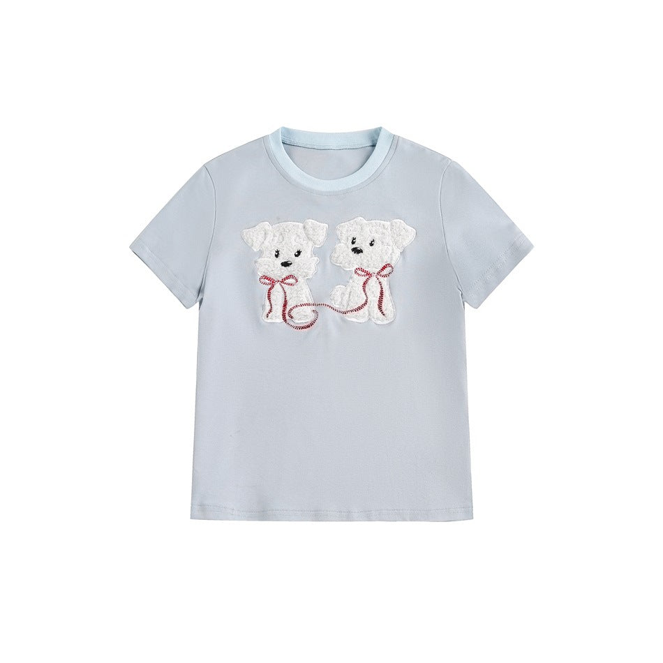 Light blue short-sleeve T-shirt with two white embroidered dog appliques and red ribbon leash on the chest