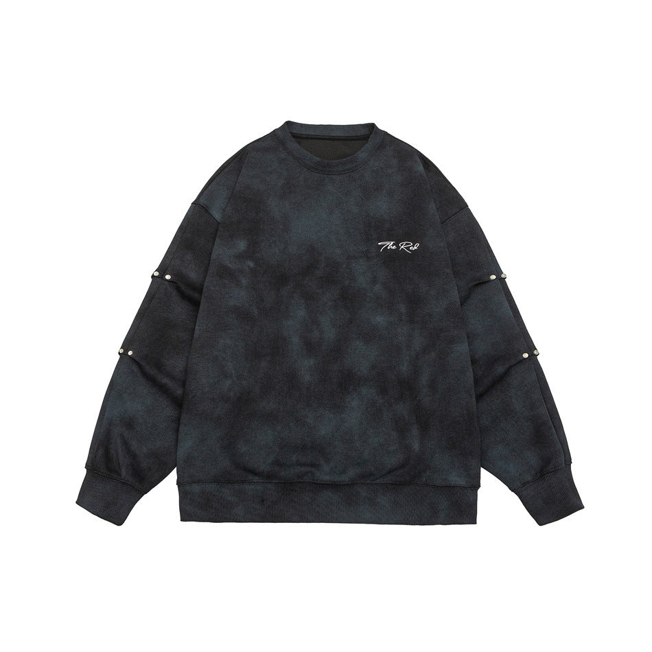 Black mottled wash crewneck sweatshirt flat lay with white chest embroidery and stud details on the sleeves
