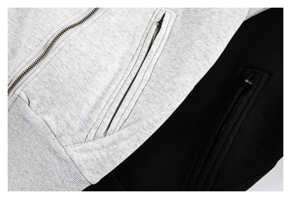 Close-up of zippered pockets on heather gray and black garments.