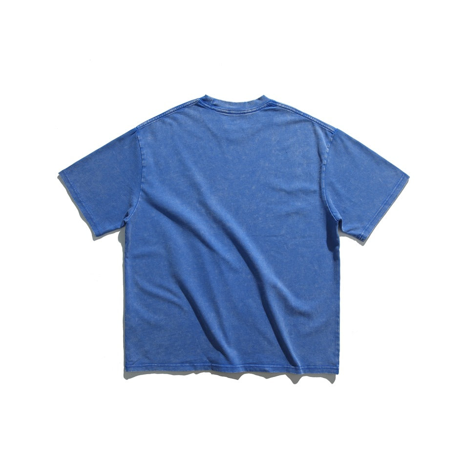 Flat lay of the plain back of a blue short-sleeve crew-neck T-shirt.