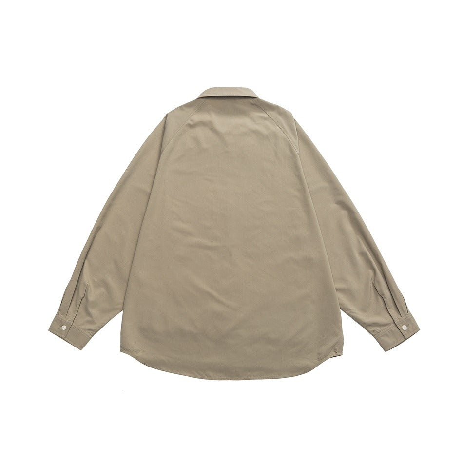 Back view of grey-green long-sleeve shirt flat lay with raglan sleeves and curved hem
