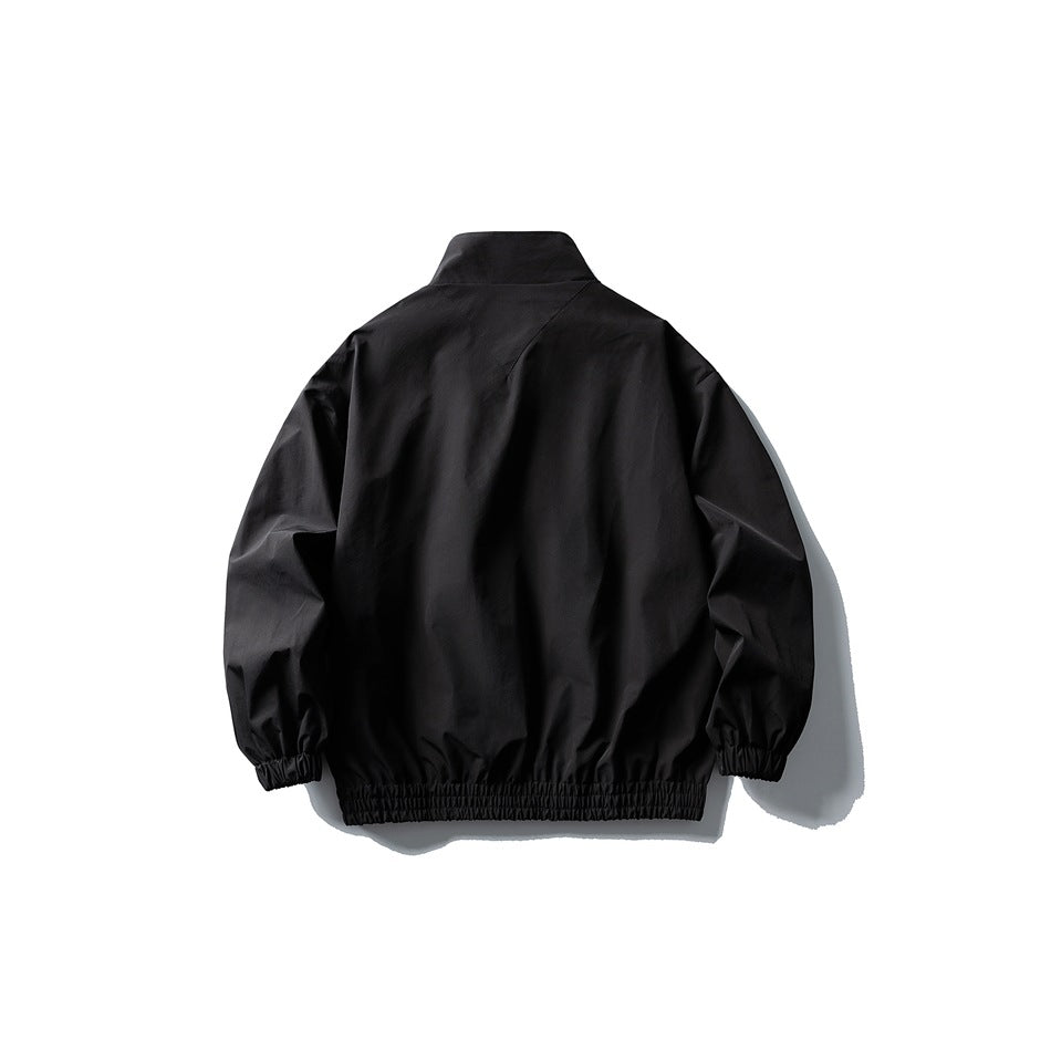Black stand-collar jacket flat lay, back view, with back yoke seam and elastic cuffs and hem