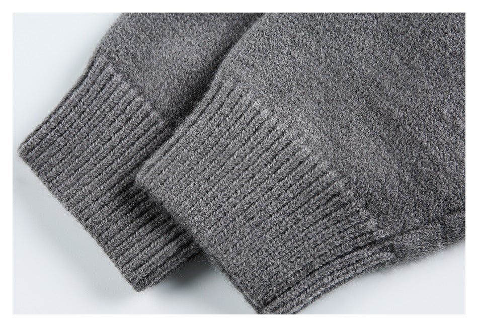 Close-up of the charcoal gray cardigan’s ribbed cuffs and knit sleeves.