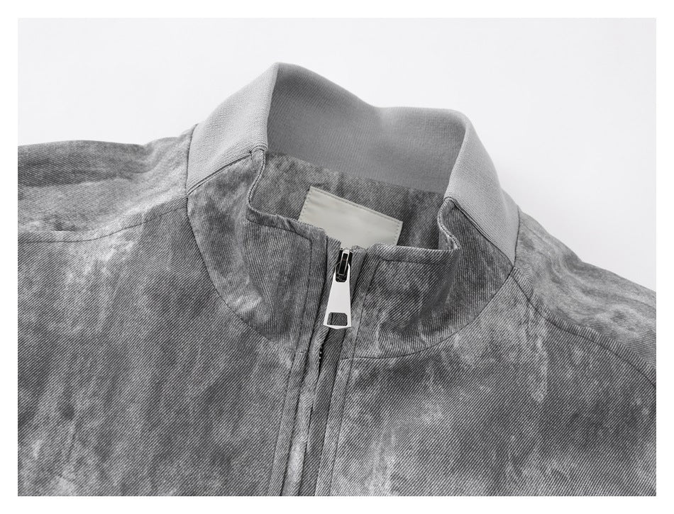 Close-up of the jacket's stand collar, front zipper and inner neck label.