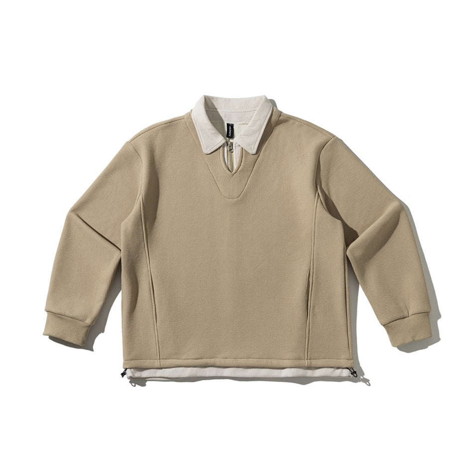 Khaki waffle-textured pullover sweatshirt with cream polo collar, quarter-zip neckline and drawcord hem, flat lay
