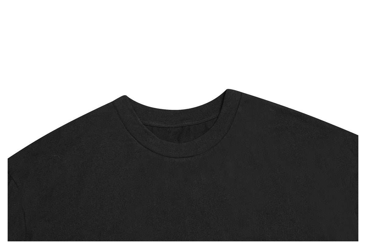 Close crop of the front neckline and upper chest of a plain black T-shirt.