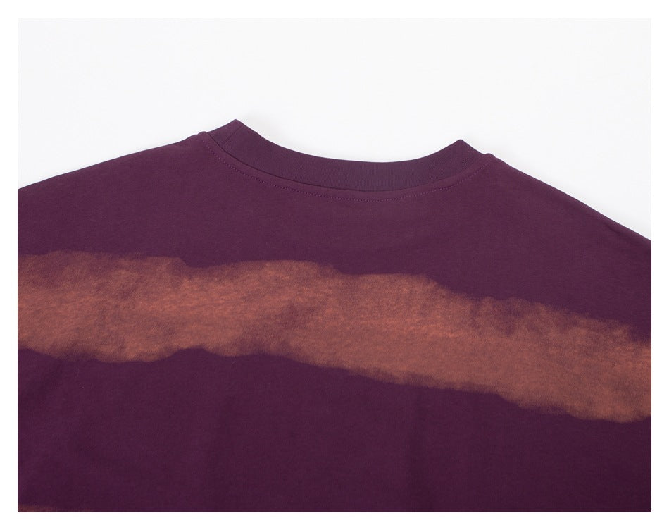 Close-up of the sweatshirt's upper back, showing a plum crew neckline and a rust-brown wavy stripe.