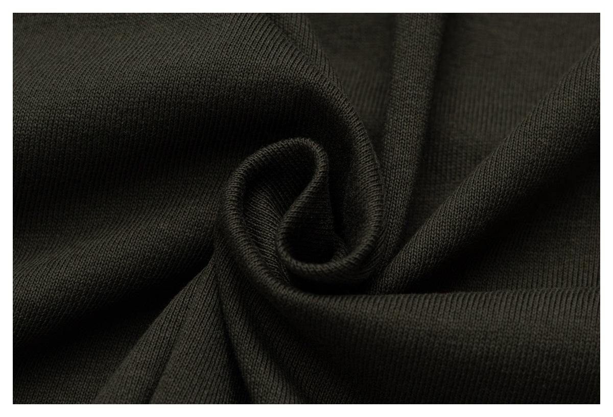 Close-up showing the dark olive fabric's knit texture and soft folds.